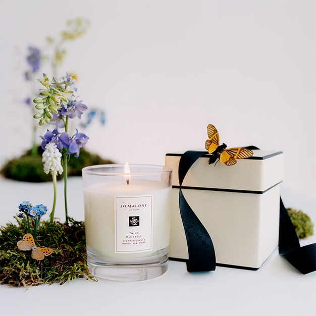 Jo Malone London home candle with a box and decorations