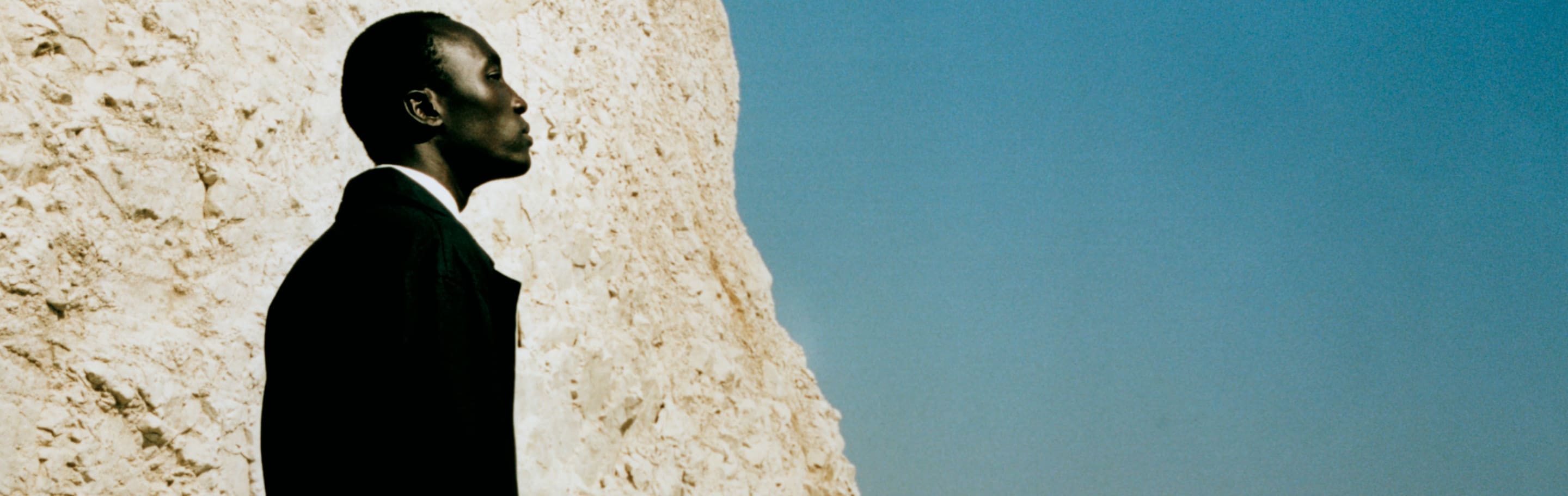 Jo Malone London Wood Sage & Sea Salt White Cliffs and sea with Man standing on left hand side 