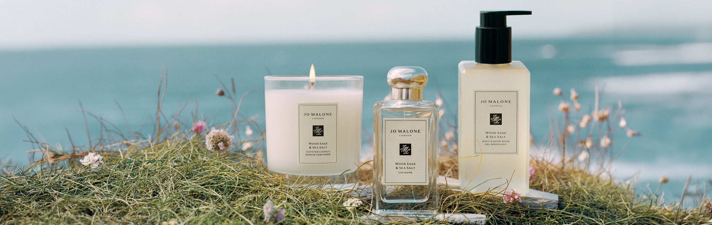 Jo Malone London Wood Sage & Sea Salt White Cliffs and sea with Man standing on left hand side 