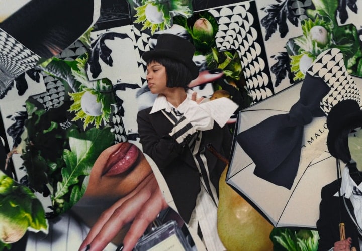 A person in a top hat sprays themselves with perfume, surrounded by a Jo Malone London display with black and white print.