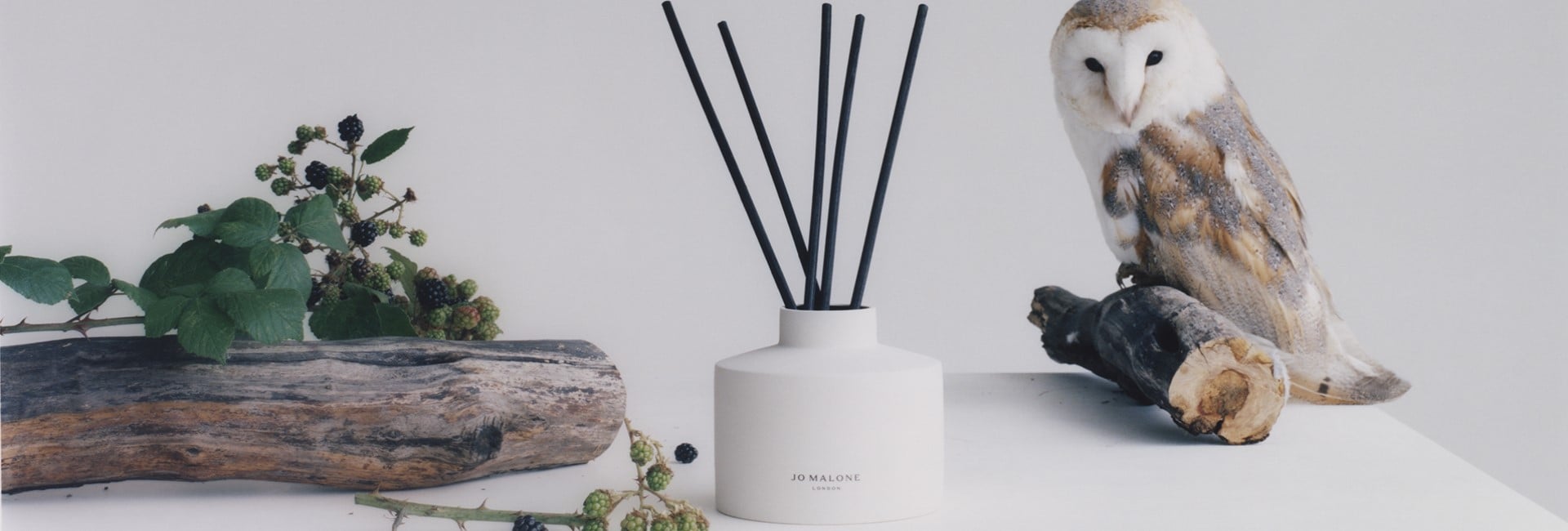 image of mantlepiece with Jo Malone townhouse candle alongside decoration